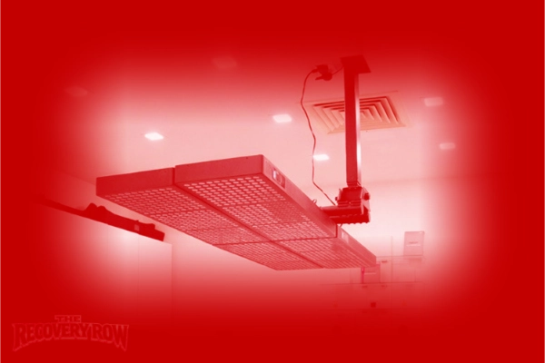 close-up of the recovery row sports massage therapy clinic with bodybud red light therapy lamp